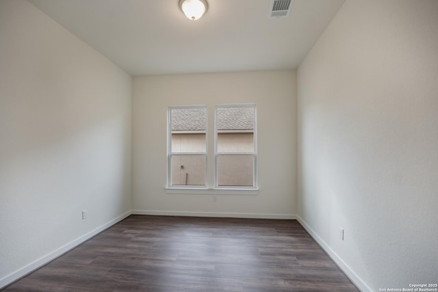 103 Valencia, Boerne, TX 78006 - unfurnished room featuring dark wood-style floors and baseboards