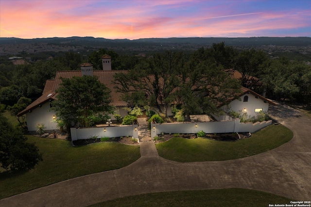 8122 Triple Crown, Fair Oaks Ranch, TX 78015 - aerial view at dusk of a wooded view