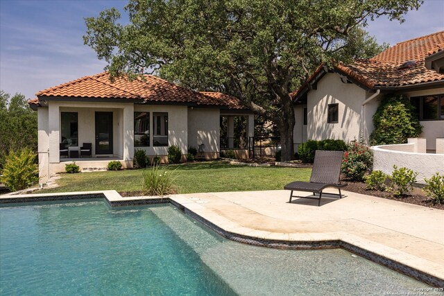 8122 Triple Crown, Fair Oaks Ranch, TX 78015 - rear view of property featuring stucco siding, a tiled roof, an outdoor pool, a patio area, and a lawn