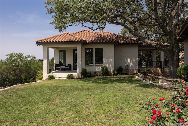 8122 Triple Crown, Fair Oaks Ranch, TX 78015 - rear view of property with stucco siding, a tiled roof, and a lawn