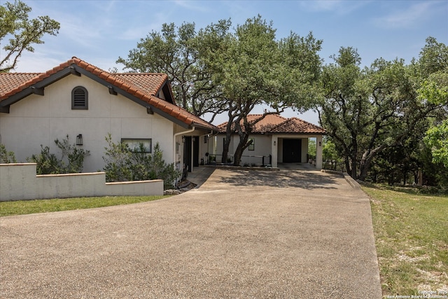 8122 Triple Crown, Fair Oaks Ranch, TX 78015 - mediterranean / spanish-style home with concrete driveway, a tile roof, stucco siding, and fence