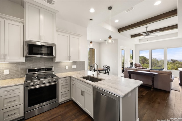 8122 Triple Crown, Fair Oaks Ranch, TX 78015 - kitchen featuring stainless steel appliances, a sink, open floor plan, backsplash, and beam ceiling