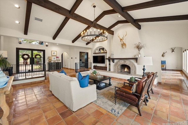 8122 Triple Crown, Fair Oaks Ranch, TX 78015 - living area featuring arched walkways, a chandelier, built in features, recessed lighting, and a warm lit fireplace