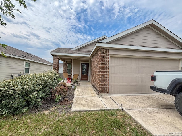 2340 Arctic Warbler, New Braunfels, TX 78130 - view of front of property featuring brick siding, covered porch, concrete driveway, and an attached garage