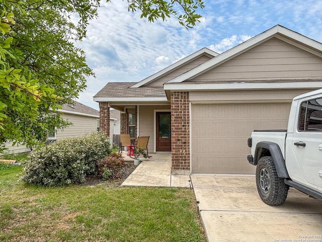 2340 Arctic Warbler, New Braunfels, TX 78130 - view of front of home featuring a garage, brick siding, covered porch, concrete driveway, and a front lawn