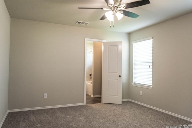 2340 Arctic Warbler, New Braunfels, TX 78130 - unfurnished bedroom featuring carpet floors, multiple windows, and baseboards