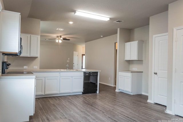 2340 Arctic Warbler, New Braunfels, TX 78130 - kitchen featuring dishwasher, a sink, range, wood finished floors, and a peninsula