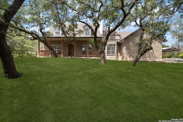 17451 Helotes Spgs, Helotes, TX 78023 - view of front of property with brick siding, a front lawn, and a porch