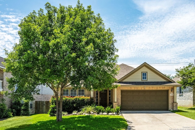 24931 Crescent Run, San Antonio, TX 78258 - view of front of house featuring brick siding, a front lawn, driveway, and a garage