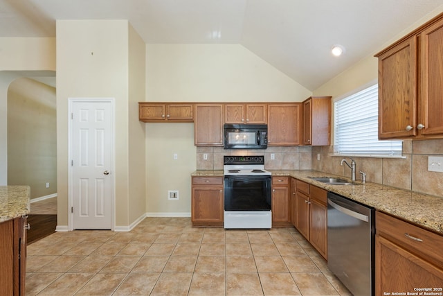 24931 Crescent Run, San Antonio, TX 78258 - kitchen with electric range oven, black microwave, stainless steel dishwasher, a sink, and brown cabinetry