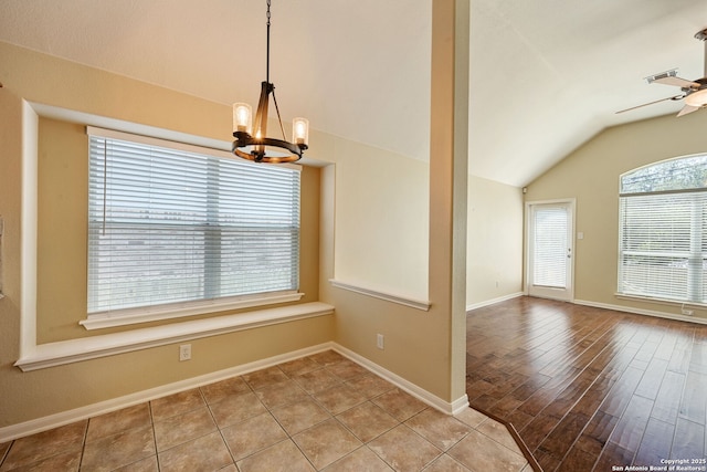 24931 Crescent Run, San Antonio, TX 78258 - unfurnished dining area featuring lofted ceiling, a chandelier, baseboards, a ceiling fan, and wood finished floors