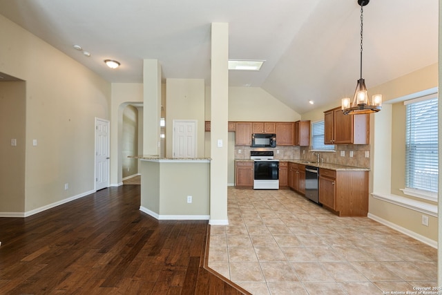 24931 Crescent Run, San Antonio, TX 78258 - kitchen with range with electric stovetop, dishwasher, black microwave, a chandelier, and vaulted ceiling
