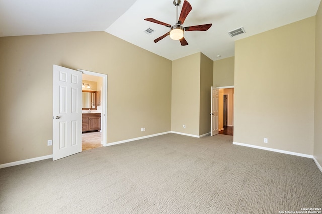 24931 Crescent Run, San Antonio, TX 78258 - unfurnished bedroom with vaulted ceiling, light colored carpet, baseboards, and connected bathroom