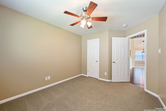 24931 Crescent Run, San Antonio, TX 78258 - unfurnished bedroom featuring baseboards, carpet flooring, and a ceiling fan