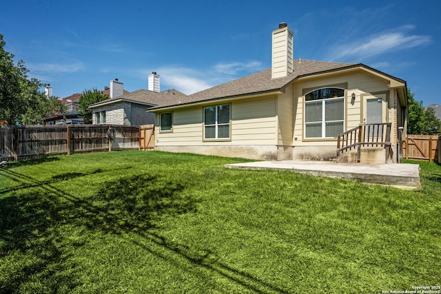 24931 Crescent Run, San Antonio, TX 78258 - back of property with a chimney, roof with shingles, and a patio