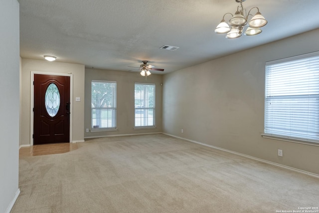 114 Arcadia Pl, Cibolo, TX 78108 - entryway with a chandelier, light colored carpet, ceiling fan, baseboards, and a textured ceiling