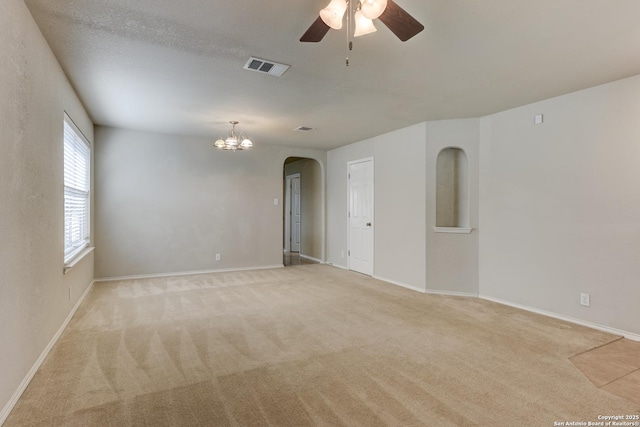 114 Arcadia Pl, Cibolo, TX 78108 - unfurnished room featuring arched walkways, ceiling fan, light carpet, baseboards, and a chandelier