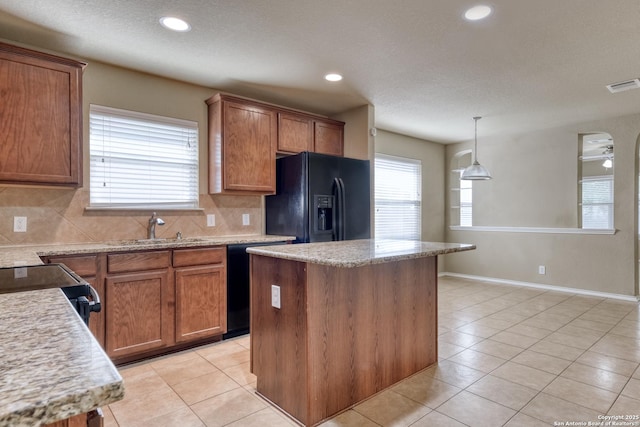 114 Arcadia Pl, Cibolo, TX 78108 - kitchen with black appliances, a sink, decorative backsplash, healthy amount of natural light, and recessed lighting
