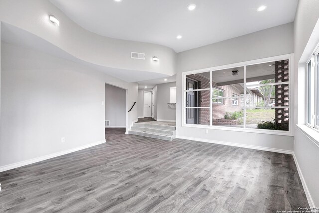 123 Riviera, Castle Hills, TX 78213 - unfurnished living room featuring baseboards, stairs, wood finished floors, and recessed lighting