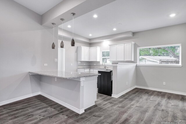 123 Riviera, Castle Hills, TX 78213 - kitchen with white cabinetry, dark wood-style flooring, light stone counters, baseboards, and recessed lighting
