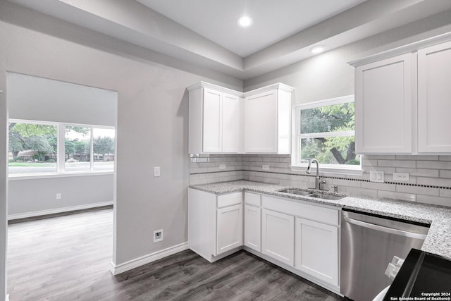 123 Riviera, Castle Hills, TX 78213 - kitchen with stainless steel dishwasher, a sink, decorative backsplash, light stone countertops, and recessed lighting