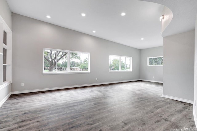 123 Riviera, Castle Hills, TX 78213 - spare room with wood finished floors, recessed lighting, and baseboards