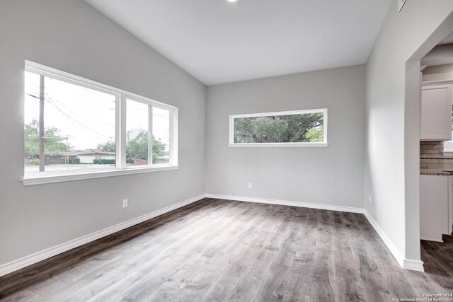 123 Riviera, Castle Hills, TX 78213 - unfurnished room with wood finished floors and baseboards
