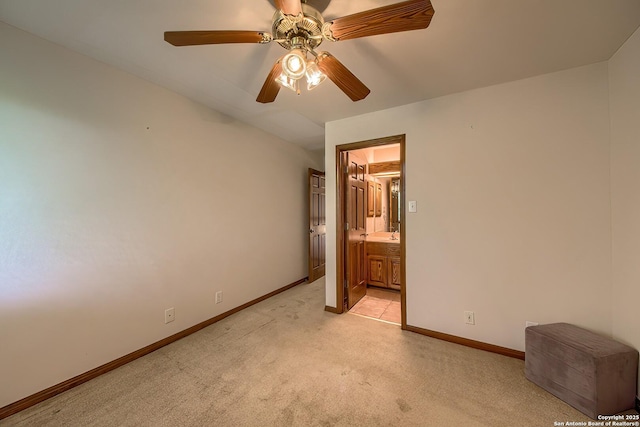 13742 Corinth, Universal City, TX 78148 - unfurnished bedroom featuring light colored carpet, baseboards, connected bathroom, and ceiling fan