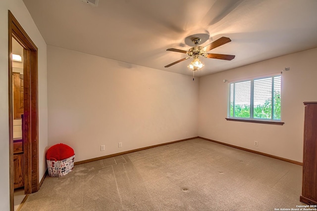 13742 Corinth, Universal City, TX 78148 - empty room featuring light carpet, ceiling fan, and baseboards