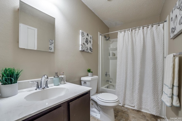 9838 Trendwood, San Antonio, TX 78250 - full bath featuring a textured ceiling, toilet, shower / bath combo with shower curtain, vanity, and stone finish floors