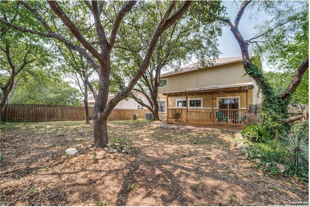 9838 Trendwood, San Antonio, TX 78250 - fenced backyard featuring a deck and central AC unit