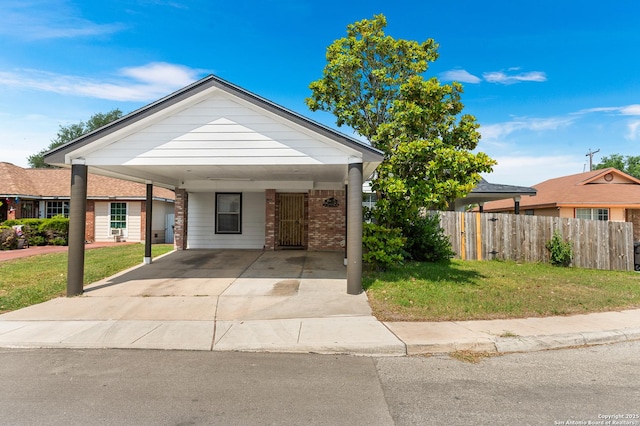 8907 Silver Bow, San Antonio, TX 78242 - view of front of property featuring a carport, brick siding, and concrete driveway