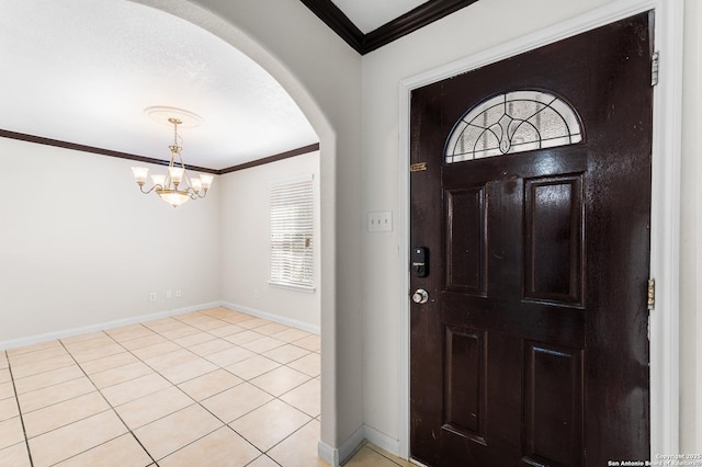 8907 Silver Bow, San Antonio, TX 78242 - foyer entrance featuring arched walkways, ornamental molding, a chandelier, baseboards, and light tile patterned floors