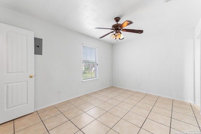 8907 Silver Bow, San Antonio, TX 78242 - spare room featuring a ceiling fan, electric panel, and light tile patterned flooring