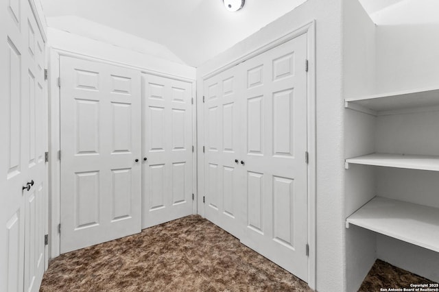 8907 Silver Bow, San Antonio, TX 78242 - corridor with dark colored carpet and lofted ceiling