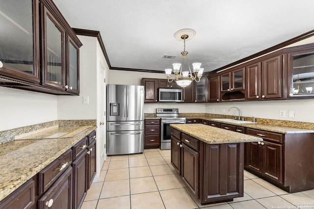 8907 Silver Bow, San Antonio, TX 78242 - kitchen with appliances with stainless steel finishes, a sink, a chandelier, dark brown cabinets, and crown molding