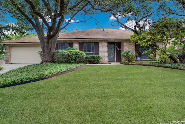 7927 Misty Park, San Antonio, TX 78250 - single story home with an attached garage, a front yard, driveway, and brick siding