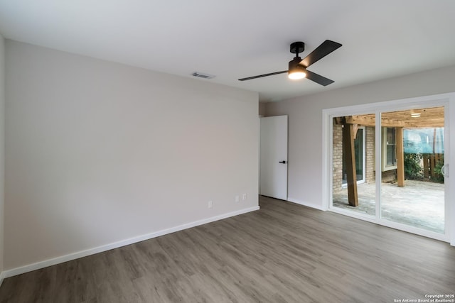 7927 Misty Park, San Antonio, TX 78250 - unfurnished room with wood finished floors, ceiling fan, and baseboards