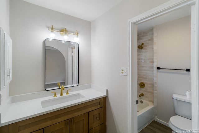 7927 Misty Park, San Antonio, TX 78250 - bathroom with vanity, toilet, wood finished floors, and tub / shower combination