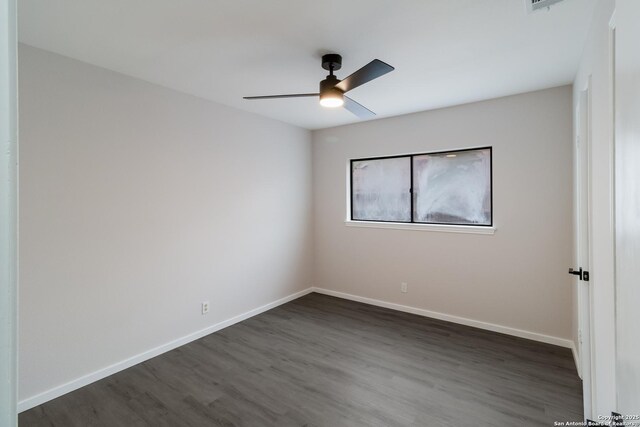 7927 Misty Park, San Antonio, TX 78250 - empty room with ceiling fan, dark wood-type flooring, and baseboards