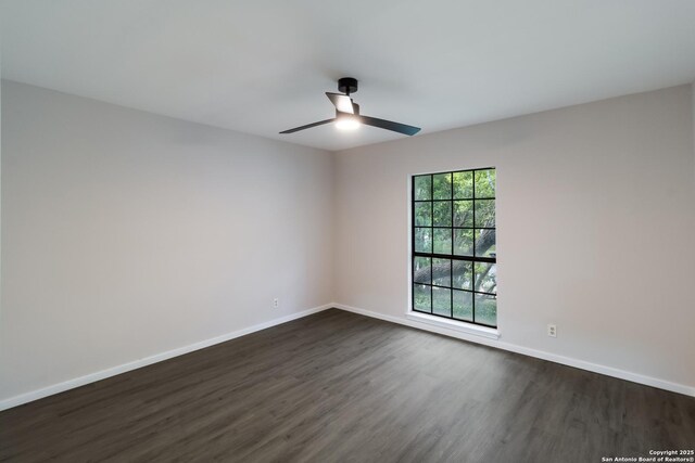7927 Misty Park, San Antonio, TX 78250 - unfurnished room featuring a ceiling fan, dark wood-style flooring, and baseboards