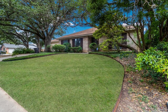 7927 Misty Park, San Antonio, TX 78250 - ranch-style house with a front lawn and brick siding