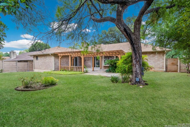 7927 Misty Park, San Antonio, TX 78250 - rear view of house with a pergola, brick siding, and a chimney