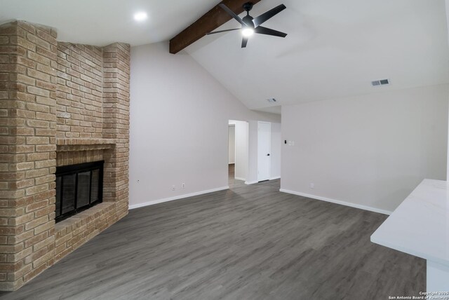 7927 Misty Park, San Antonio, TX 78250 - unfurnished living room with a ceiling fan, a fireplace, dark wood-type flooring, and baseboards