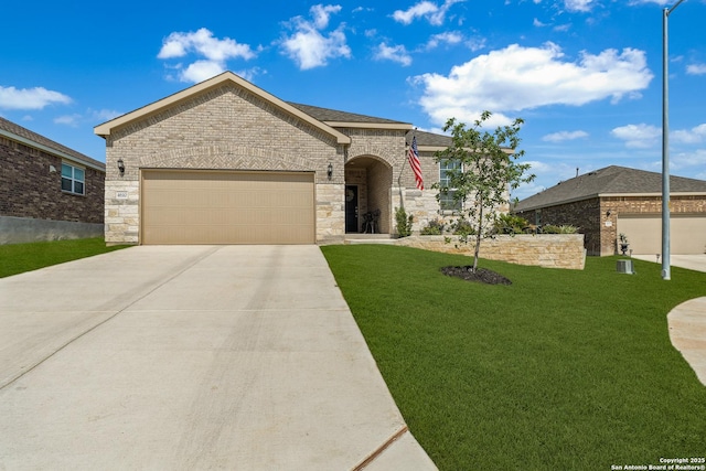 4610 Honeydew Rdg, San Antonio, TX 78253 - french country home featuring driveway, an attached garage, a front yard, stone siding, and brick siding