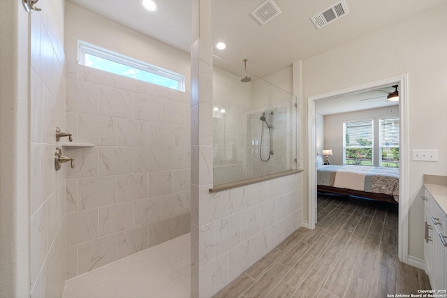 4610 Honeydew Rdg, San Antonio, TX 78253 - ensuite bathroom with a walk in shower, wood finished floors, plenty of natural light, and recessed lighting