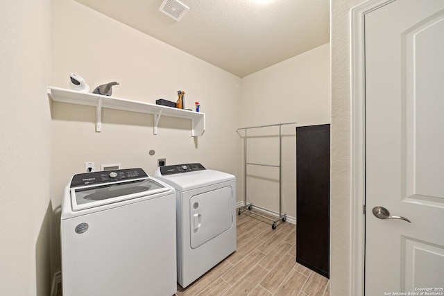 4610 Honeydew Rdg, San Antonio, TX 78253 - laundry room featuring washer and clothes dryer, wood finish floors, and baseboards