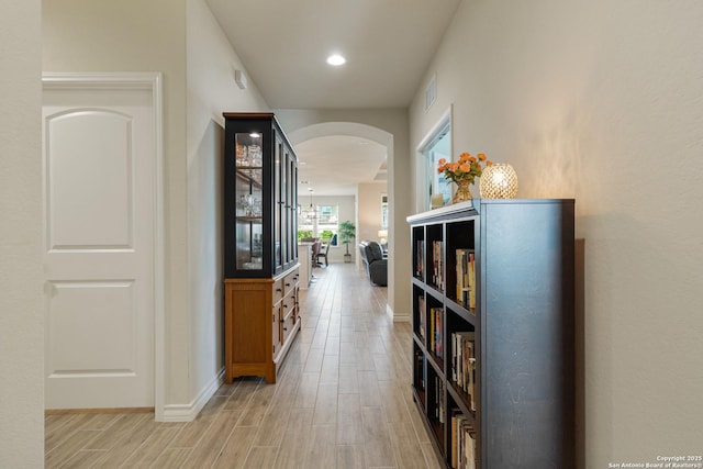 4610 Honeydew Rdg, San Antonio, TX 78253 - corridor with arched walkways, light wood-type flooring, baseboards, and recessed lighting