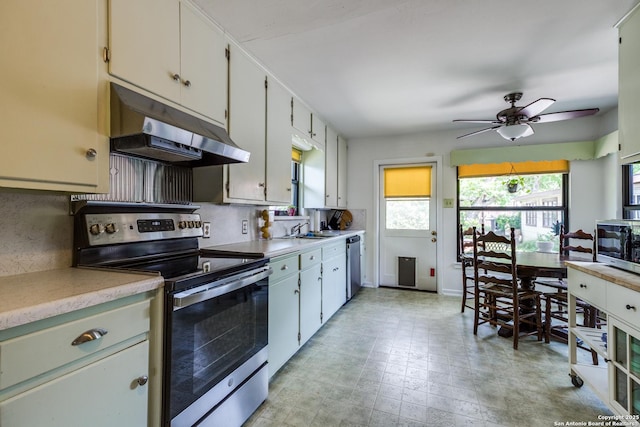 119 Janis Rae, San Antonio, TX 78201 - kitchen with under cabinet range hood, appliances with stainless steel finishes, a sink, light countertops, and ceiling fan