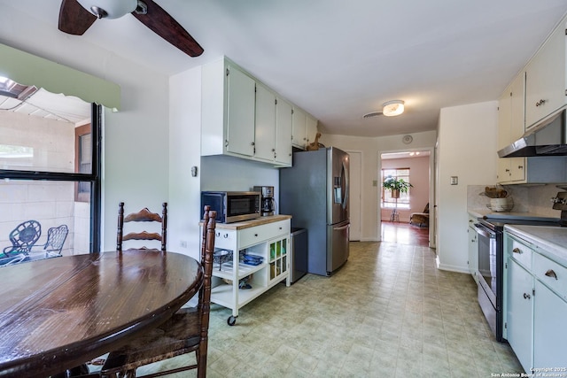 119 Janis Rae, San Antonio, TX 78201 - kitchen featuring stainless steel appliances, under cabinet range hood, a ceiling fan, light floors, and light countertops